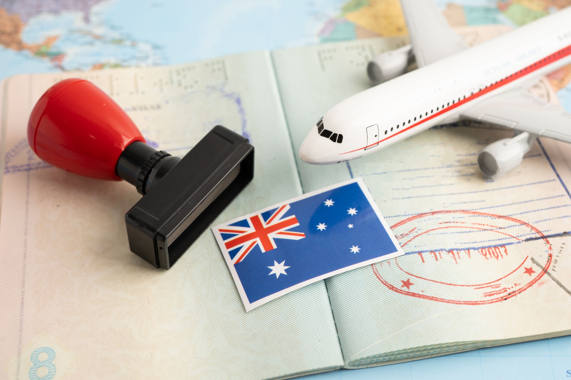 Australia flag with passport and airplane for travel.
