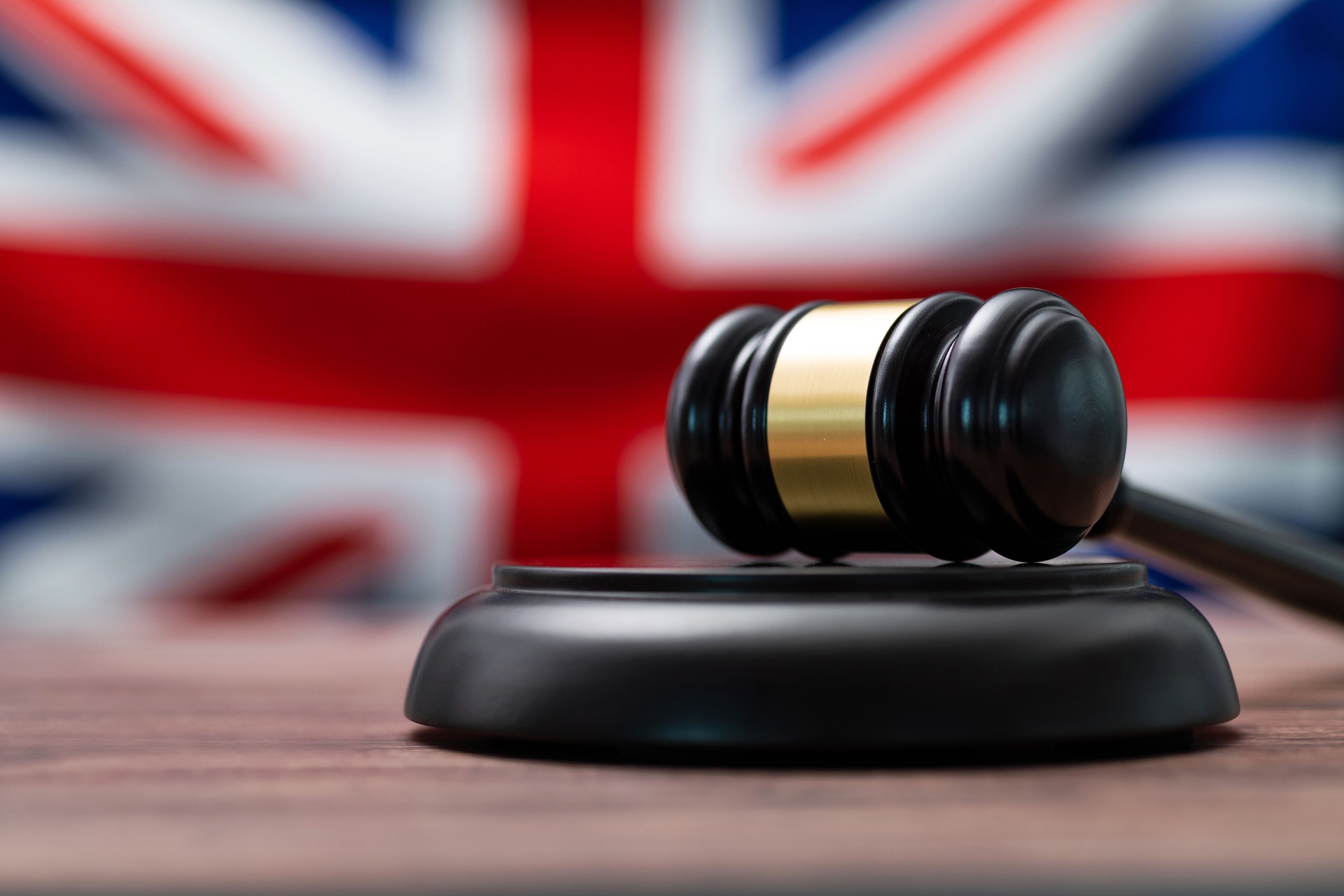 Wooden gavel and British flag